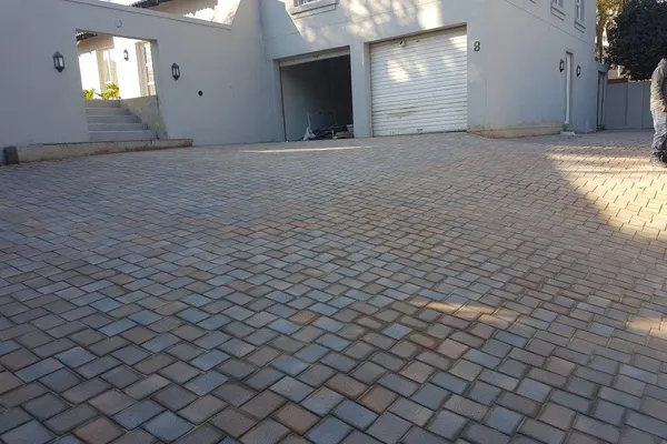 Luxury Home Courtyard - Expansive paved area for a luxury home with professional landscaping integration. by Northern Paving