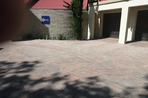Residential Driveway - Sandton - Premium brick paving with beautiful pattern design for a modern home entrance. by Northern Paving