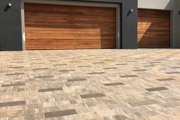 Modern Driveway - Randburg - Contemporary brick paving design for a luxury home with geometric patterns. by Northern Paving